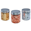 Three glass jars filled with metallic foil flakes in gold, copper, and silver for crafting projects