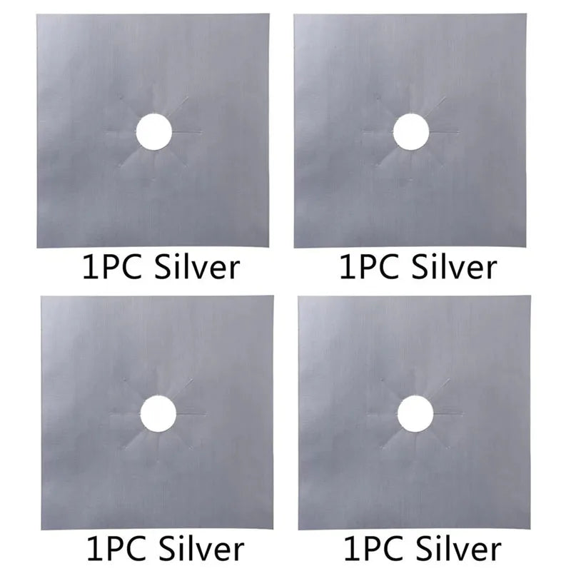 Four individual pieces of silver stove burner mats, each featuring a circular hole.