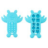 A light blue silicone baby teether toy shaped like a remote control, featuring buttons and various cutouts.