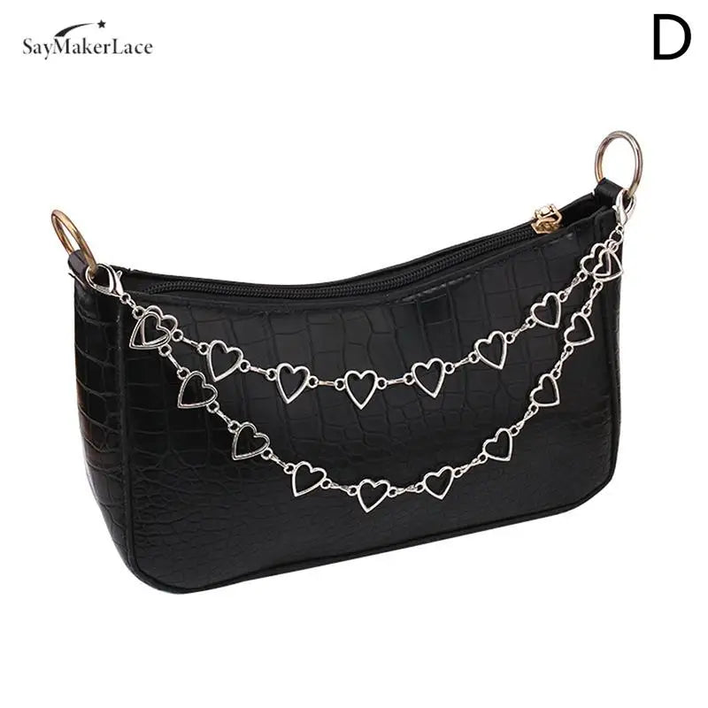 Black faux leather clutch bag with a multi-layer silver chain strap and heart pendant charms