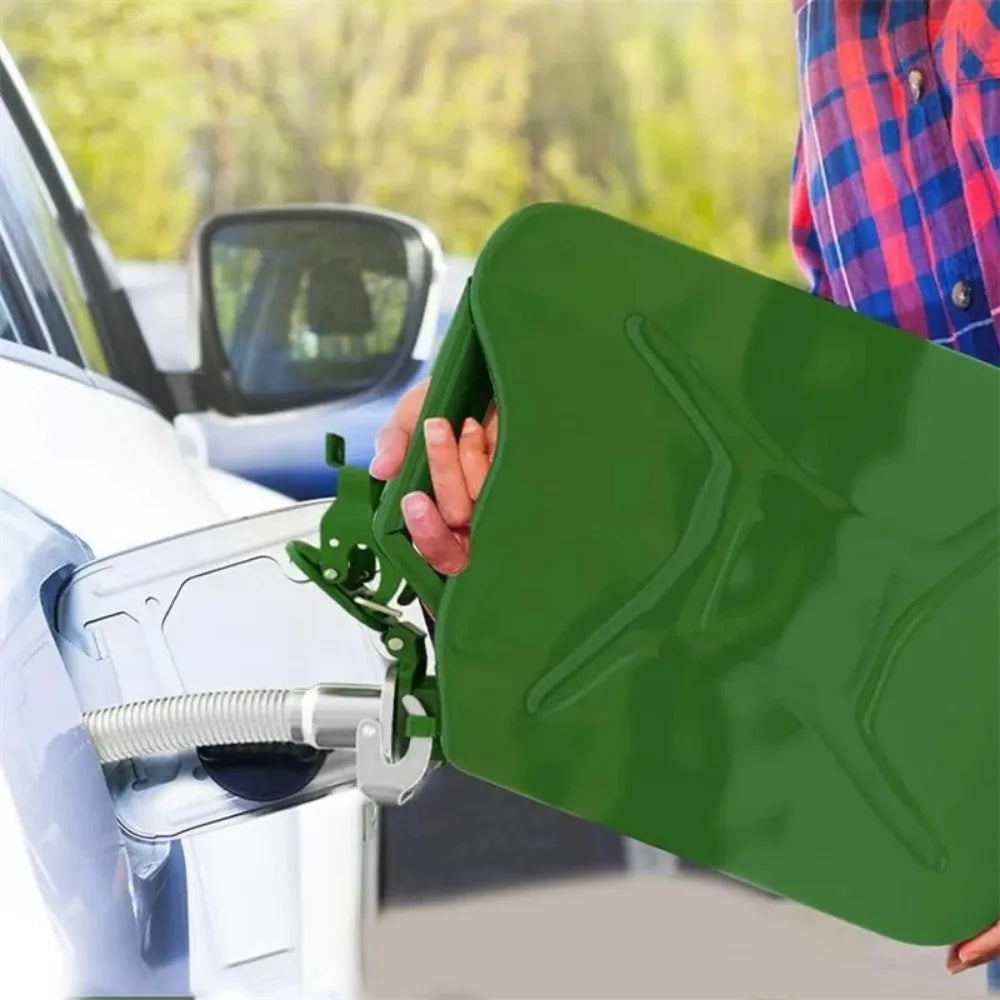 A hand is holding a green leak-proof seal for a universal Jerry can spout on a vehicle.