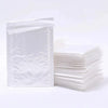 A stack of white padded bubble mailers with self-seal closures is shown on a white background.