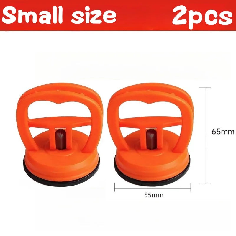 Two orange heavy duty car dent puller suction cups with 65mm length and 55mm width