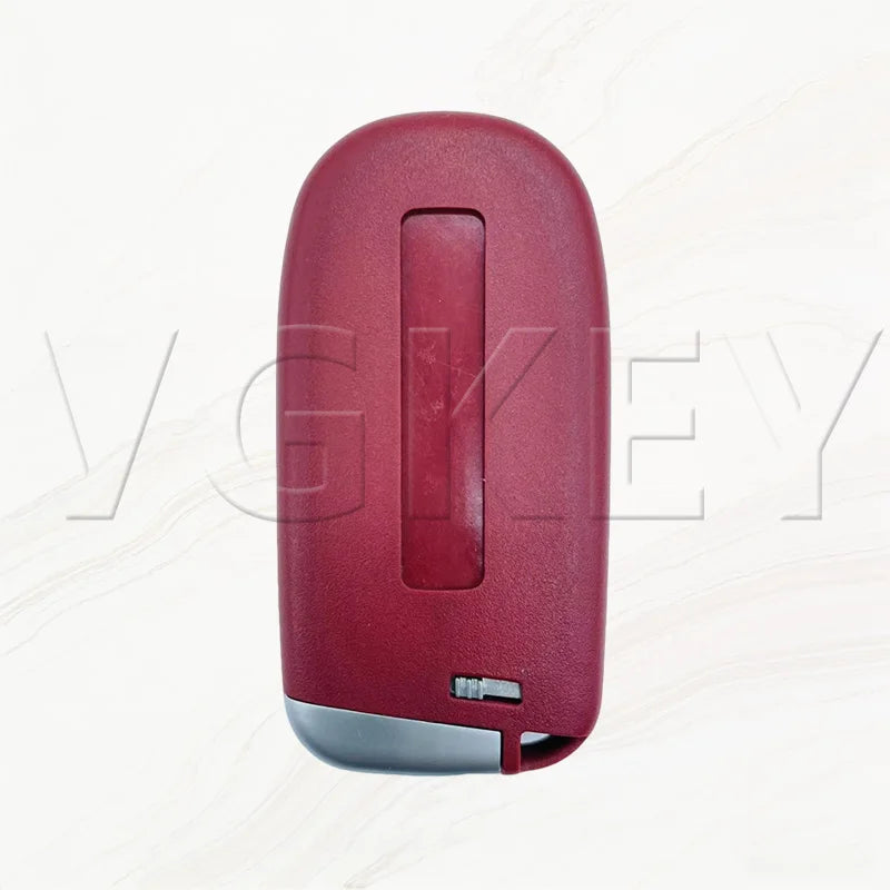 A close-up view of a red replacement smart key shell for Dodge Challenger and Charger models.