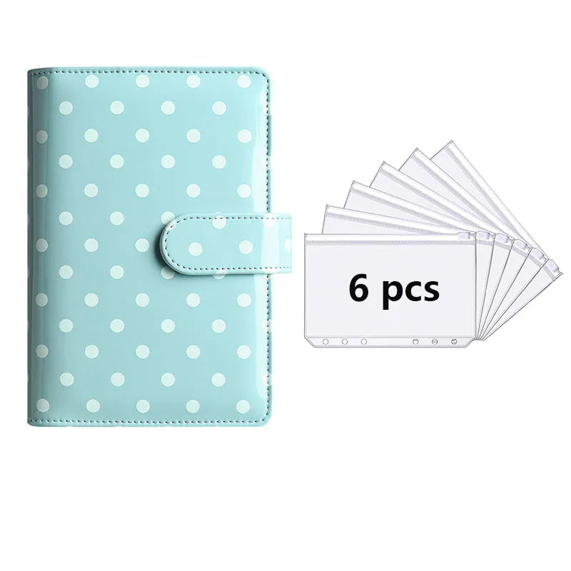 A light blue polka dot PU leather binder wallet with a card holder and cash envelopes.