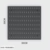 A gray pegboard organizer board measuring 30cm by 30cm with numerous holes for pegs and hooks.