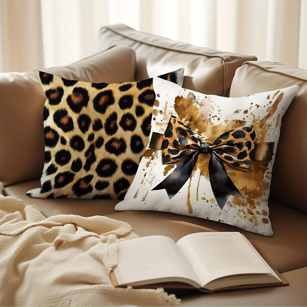A decorative pillow featuring a leopard print fabric with a black bow on a beige sofa.