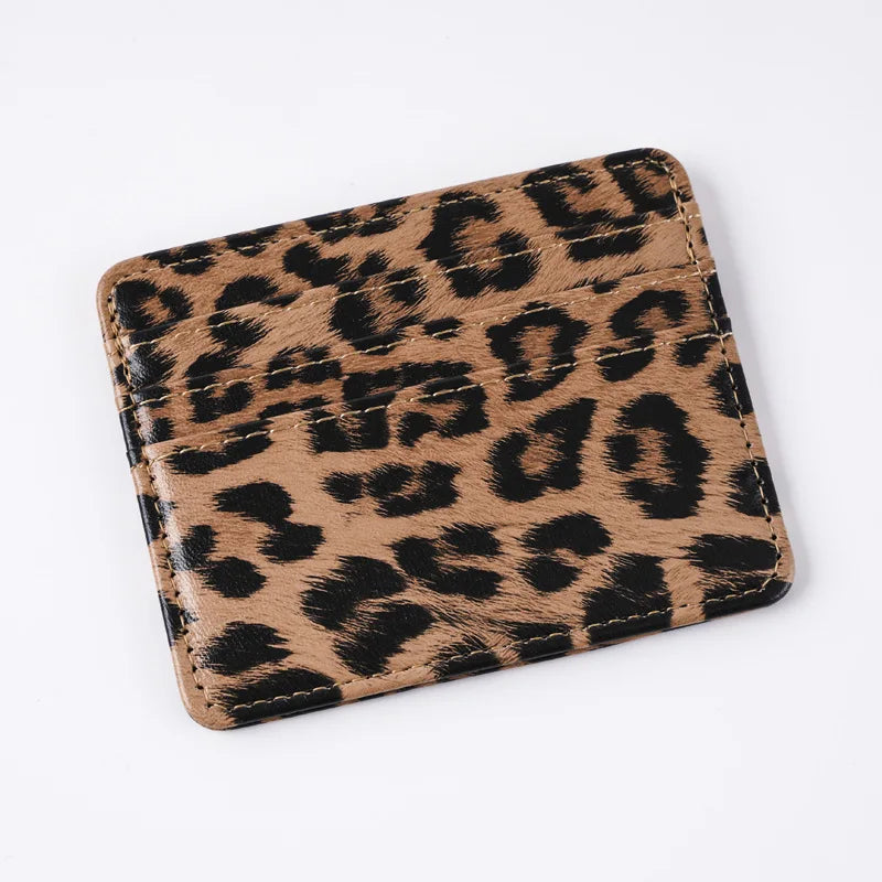 A brown leopard print PU leather card wallet shown from above.