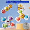 A three-piece set of suction cup fidget toys in various colors and shapes shown against a light blue background.