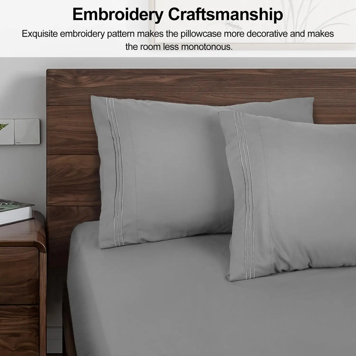 A set of two gray soft brushed microfiber pillowcases with envelope closure displayed on a bed.