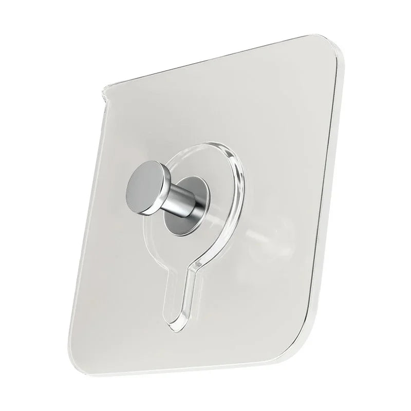 A clear, square adhesive hook with a silver mounting mechanism for wall installation.
