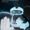 A white robot toy with glowing blue eyes is shown interacting with a hand, demonstrating waving gesture fun sensing control.
