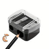 Clear plastic automatic dual-hole pencil sharpener with a black base and an orange pencil tip.