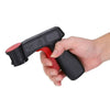 A hand holds a black and red ergonomic spray paint gun handle for aerosol cans.