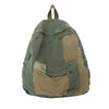 A olive green canvas patchwork backpack with brown accents.