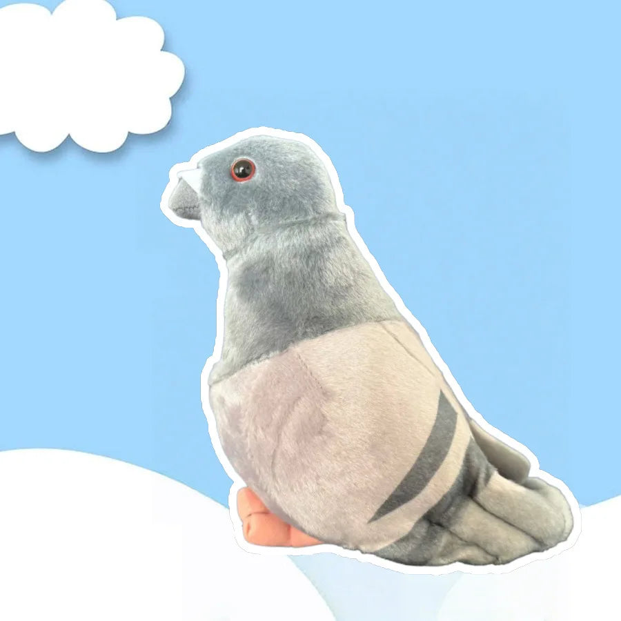 A soft gray plush toy of a pigeon with a slightly wrinkled appearance is shown against a light blue background.