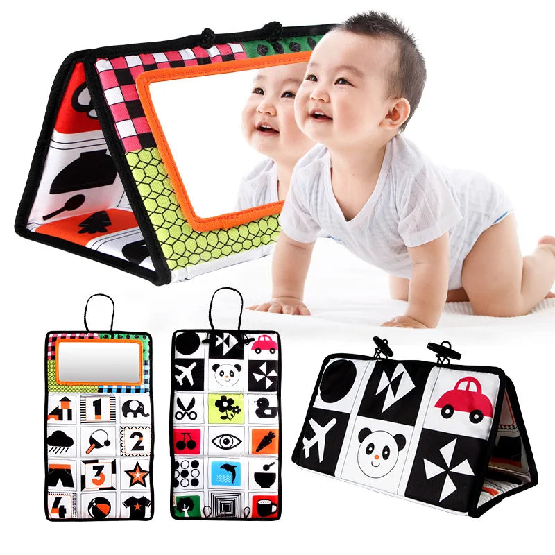 A high-contrast crinkle cloth book with a tummy time mirror for babies featuring various shapes and animals.