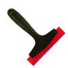 A black silicone scraper tool with a red edge used for grout and sealant work.