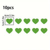 Ten green heart stickers for night safety and car decoration, measuring 6cm or 2.3 inches each.