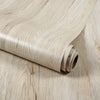 Roll of light beige wood grain wallpaper film showing the texture and rolled edge.