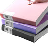 A pink A4 expanding file organizer with clear pocket dividers is shown being opened by a hand.