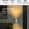 A soft white wall light illuminates a bedroom setting, demonstrating glare-free illumination.