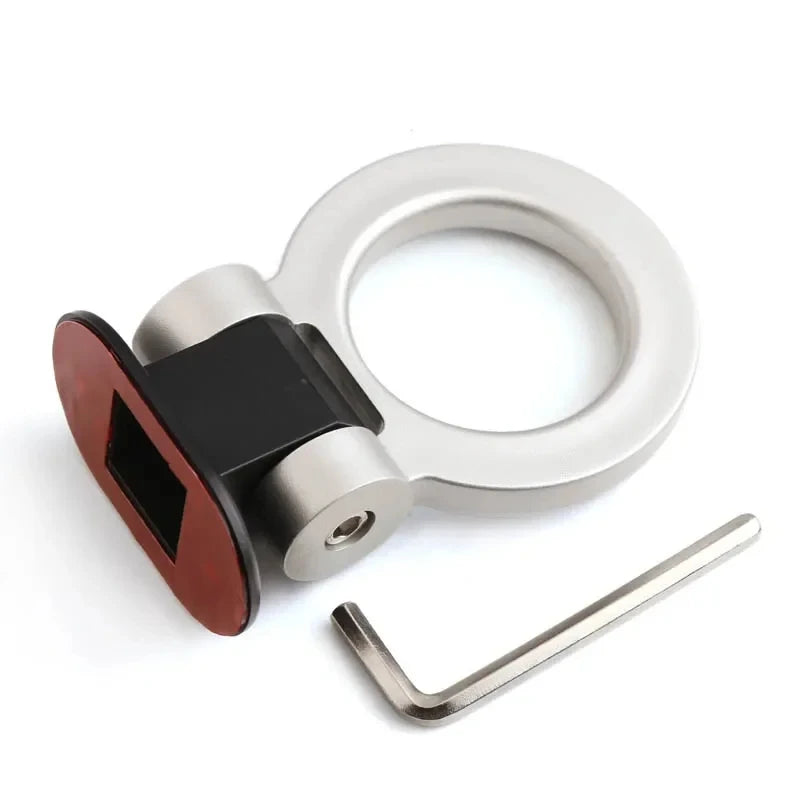 A silver decorative hook and mounting bracket for a car trailer.