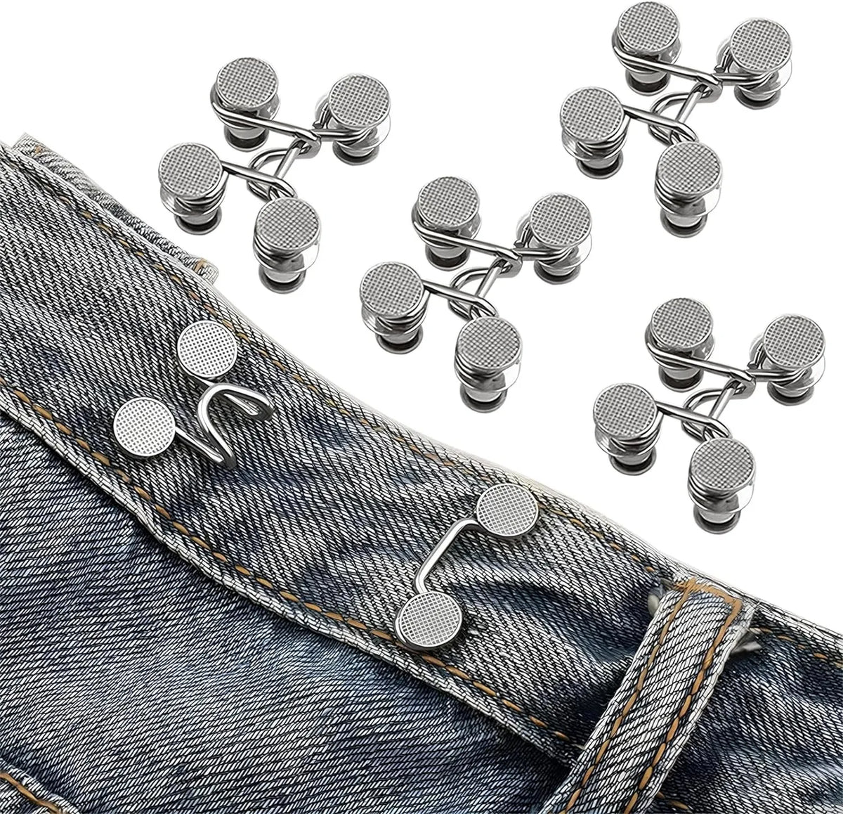 Silver jean buttons and extenders are shown on a denim jean fabric.