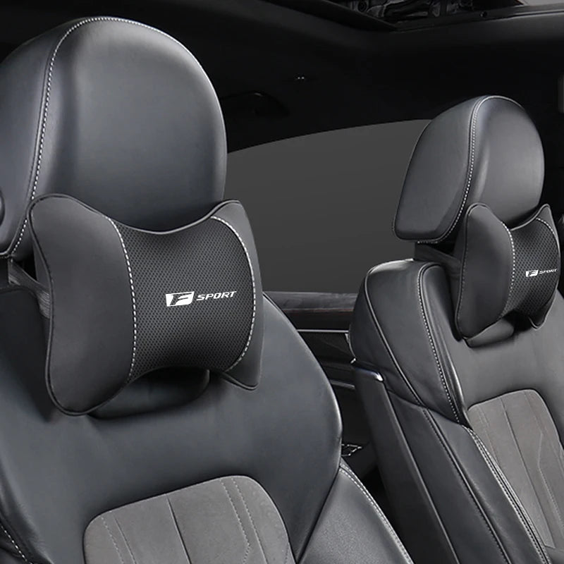 Black memory foam car seat headrest neck pillow shown in a vehicle interior.