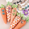 A collection of pearlized resin flower beads in various colors and shades arranged for DIY jewelry making.