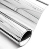 A close-up view of silver one-way mirror window film rolled up, showing its reflective surface.