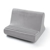 A gray adjustable comfort tablet and phone stand pillow with ribbed cushioning.