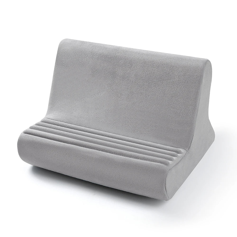 A gray adjustable comfort tablet and phone stand pillow with ribbed cushioning.