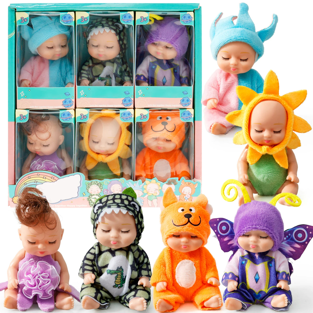 A collection of mini reborn baby dolls with various outfits and accessories displayed in a box.