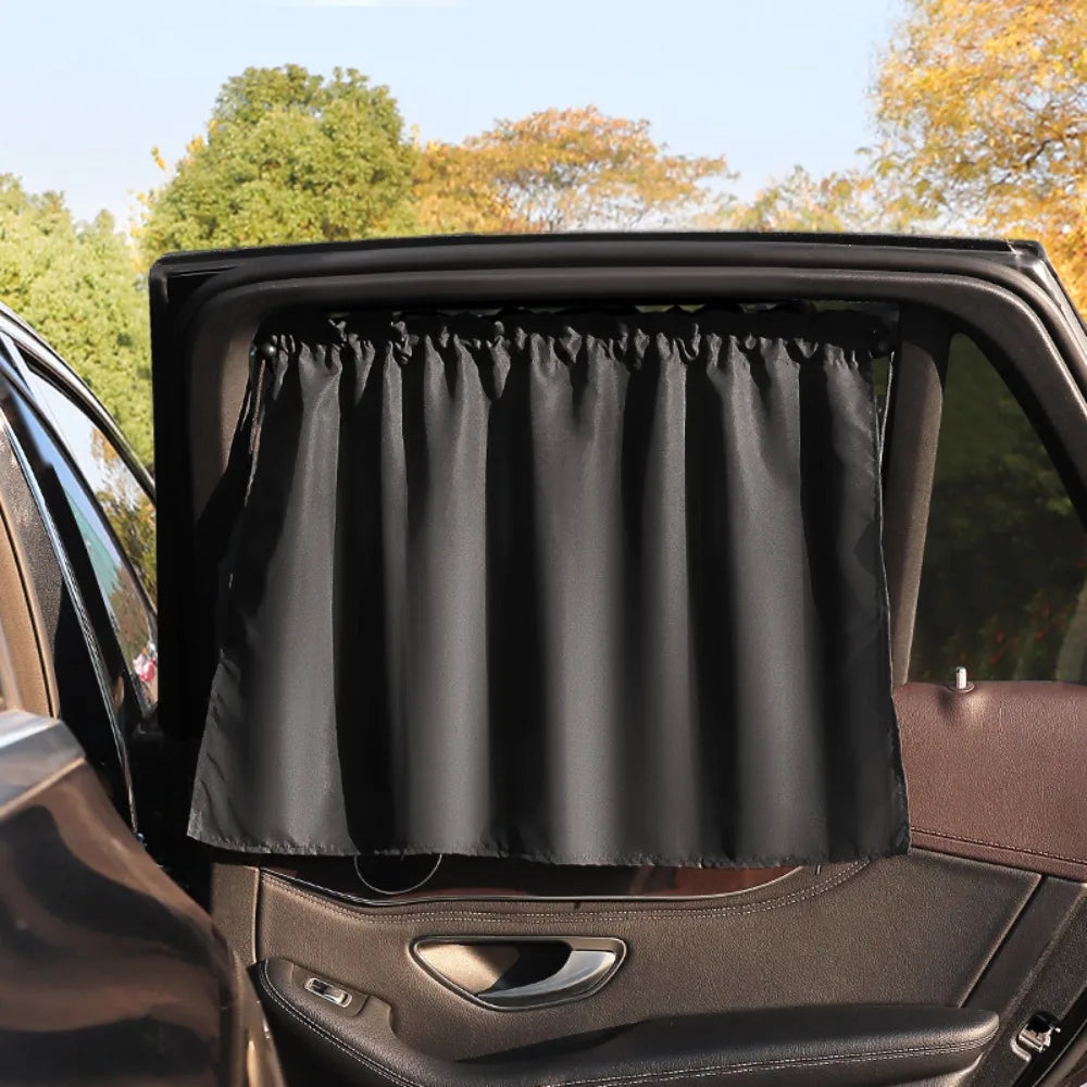 A black universal car side window sunshade is shown installed in a vehicle interior.
