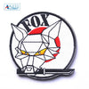 Embroidered patch featuring a stylized fox head design with hook and loop backing.