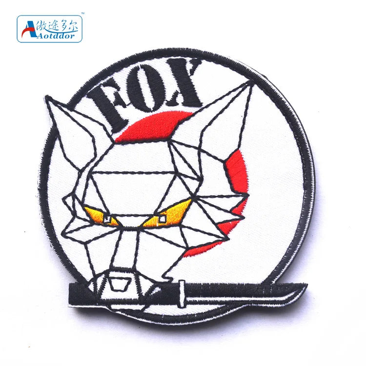 Embroidered patch featuring a stylized fox head design with hook and loop backing.