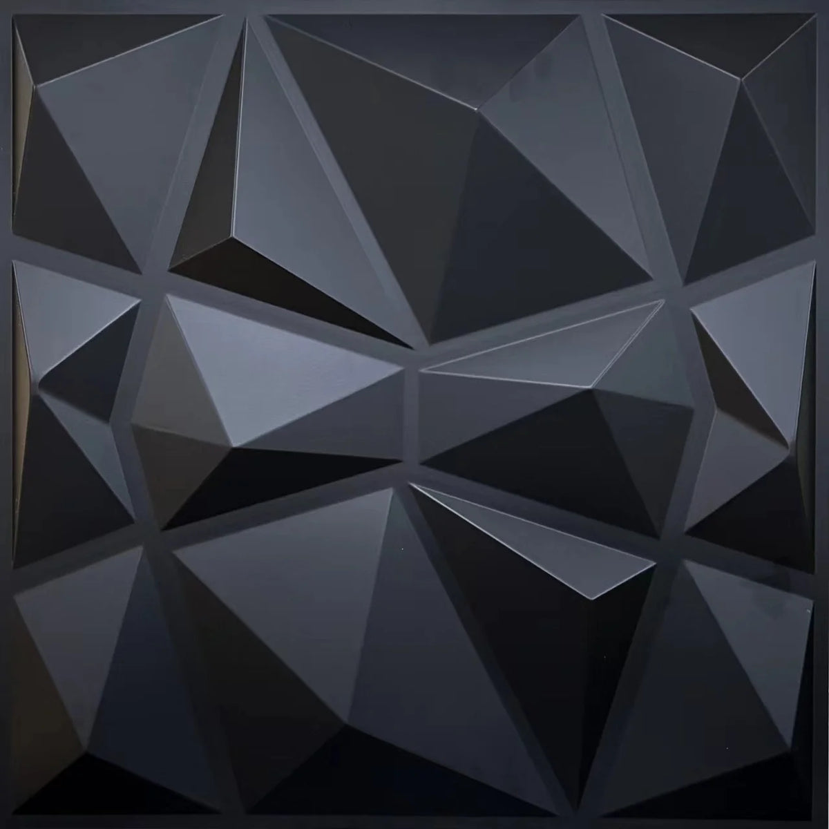 A close-up view of a dark gray, geometric 3D diamond wall panel texture.