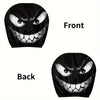 A pair of black headrest covers featuring a menacing evil grin design, shown from the front and back.