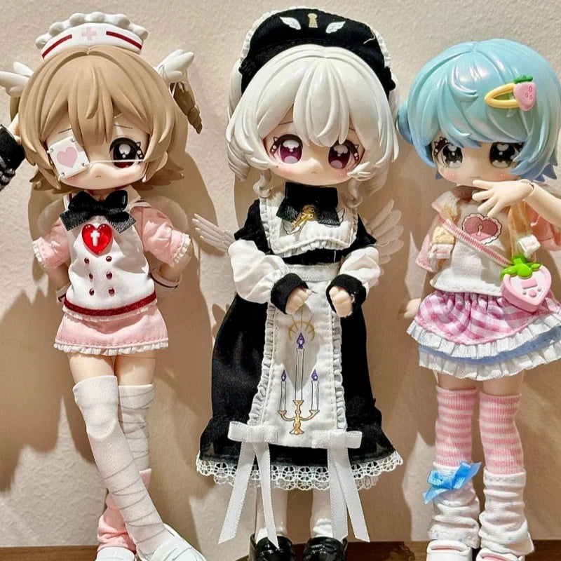 Three articulated BJD collectible figurines featuring pink and white outfits with black accents