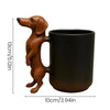 A brown dachshund shaped coffee mug with a 3D puppy handle.
