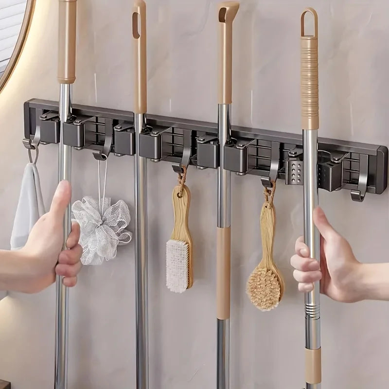 Wall-mounted metal holder for mop and broom with detachable hooks and wooden handles