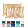 A set of silky smooth satin pillowcases in various shades including gold, pink, green, red, black, and blue.