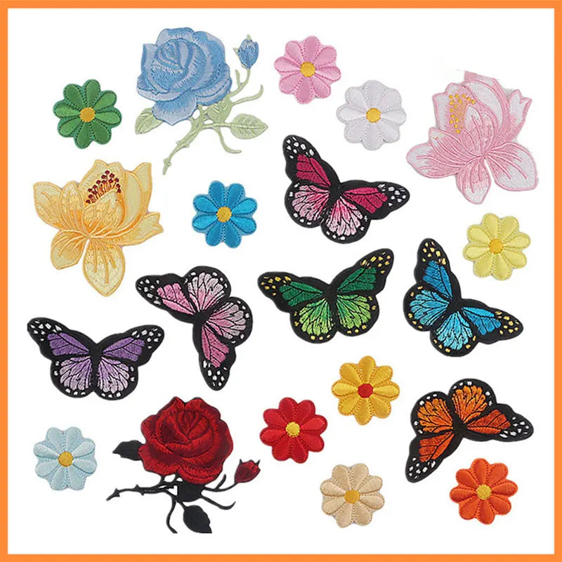 A collection of embroidered iron-on patches featuring various flowers and butterflies in shades of pink, blue, yellow, green,