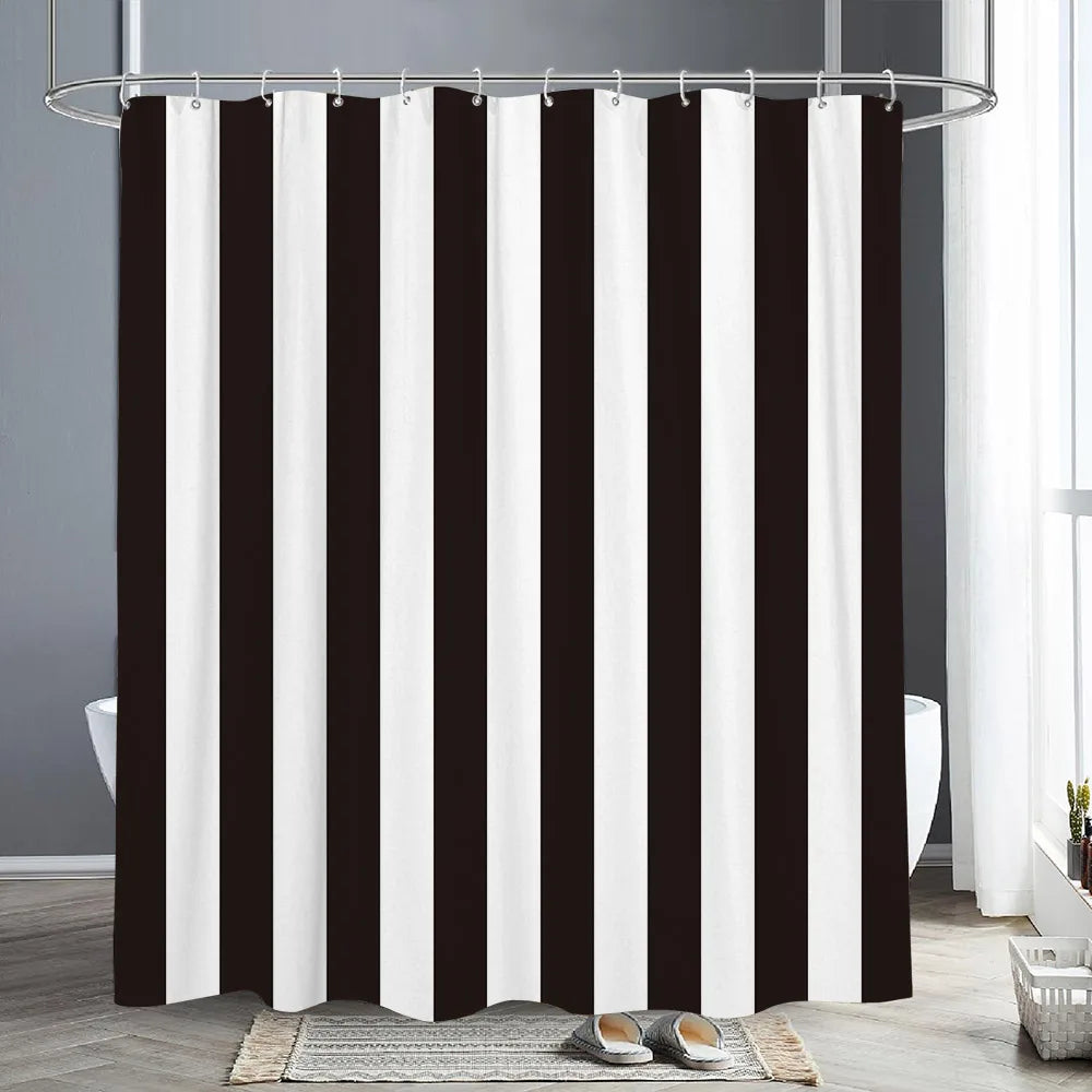 Black and white vertical striped shower curtain hanging from a metal rod in a bathroom setting.