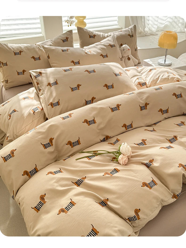 A beige duvet cover set featuring a cute dog print pattern on the fabric.