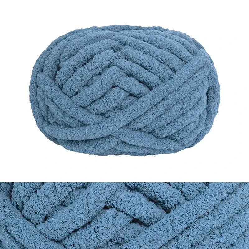 A ball of light blue chunky chenille yarn used for hand knitting and crochet