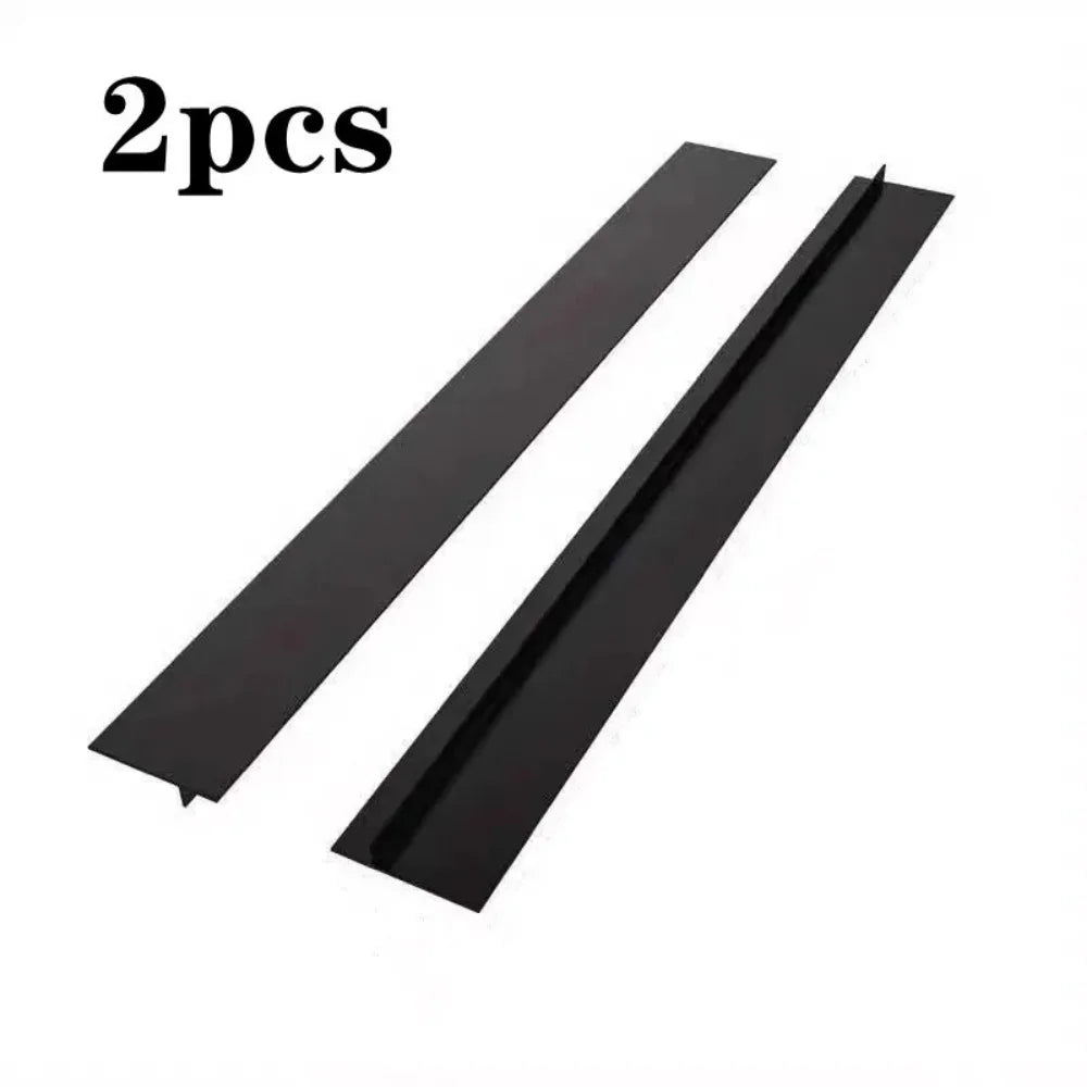 Two black T-shaped silicone stove gap covers are shown diagonally.