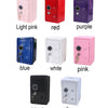 A collection of vintage metal piggy banks in various colors including light pink, red, purple, blue, white, pink, black, and 