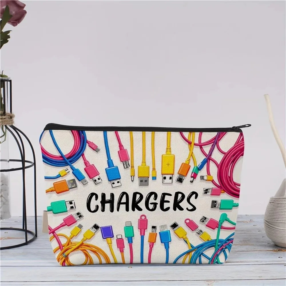 A canvas charger storage pouch with various colored charging cables and adapters is displayed on a light wooden surface.
